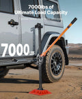 VEVOR 48-inch high-lift farm jack with base, black steel frame and orange handle beside an SUV