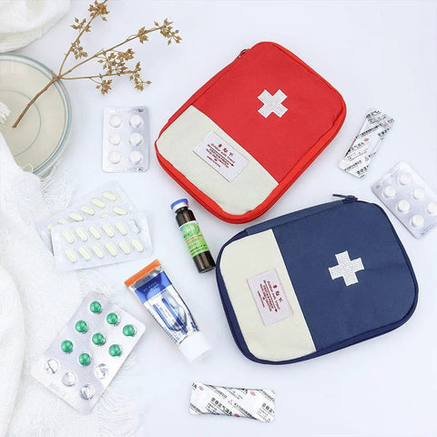 4 Pack Travel First Aid Pouches Durable 600D Oxford Exterior Grab And Go Ready Portable Outdoor Medical Bags Multi Function Emergency Kit Organizer 7 By 5 Inches Zippered Red And Blue displayed with medicine packs.