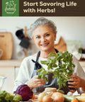 Older woman in kitchen holding fresh herbs, surrounded by vegetables, promoting Indoor Herb Garden Kit With Eight Heirloom Seeds For Windowsill.