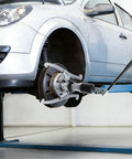 Heavy Duty 20 Ton Hydraulic Gear Puller 3 Jaw Bearing Extractor in action on a car wheel during mechanic work.