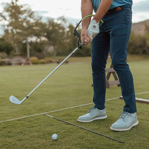 Golfer using Right Hand Golf Swing Training Aid That Improves Clubface Awareness, Swing Plane, And Impact For Consistent Distance