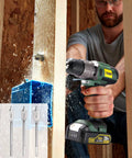 Man using DIY Ready Home Tool Kit With Drill Driver, 21 Plus 1 Torque Settings, in wood drilling project
