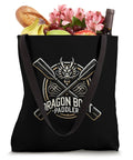 Dope Dragon Boat Paddler Tote Bag With Dragon Head Centerpiece, Crossed Paddles And Wave Motifs, 16x16in canvas tote filled with groceries.