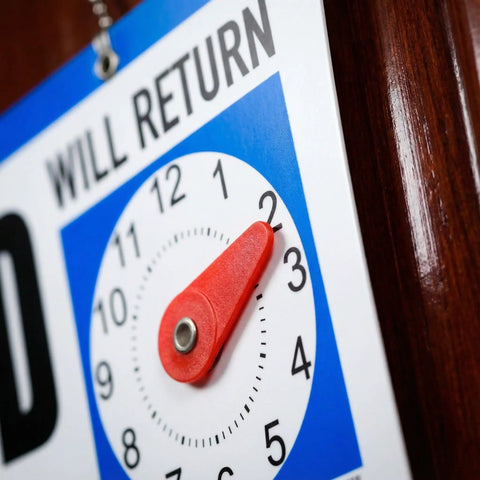Close-up of Double-Sided Closed Sign with Clock and Will Return Indicator, adjustable return time, hanging chain visible.