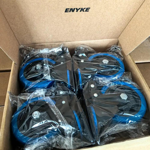 4 Inch Heavy Duty Caster Wheels Set Of Four With Dual Locking Brakes and Polyurethane Foam Treads in box, ready for installation.