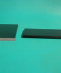 Swivel Rocker Spring Plates Replacement Parts Two Pack Two And A Half Inch By Five Inch By One Quarter Inch Black For Fiberglass Rocker Springs And Patio Chairs Lawn Yard Furniture Repair, showing two black fiberglass plates on turquoise background.