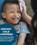 Instant cold compress front view being applied to a child's head, blue packaging visible.
