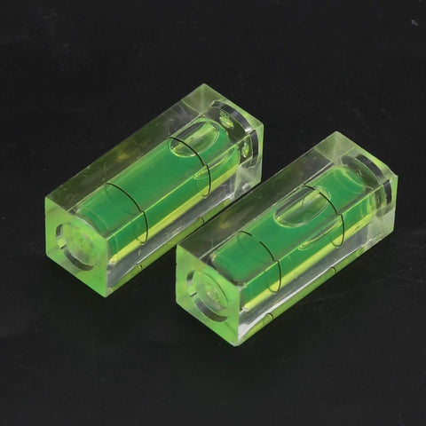 Small Spirit Level Square Bubble Level High Optical Transparency Material, two green bubble levels on black background.
