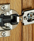 Soft-Close 1/2 Inch Overlay Hinge With Blumotion, Nickel Finish, Screw-On For Face-Frame Cabinets, installed on wood panel