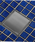 Heavy Duty Stainless Steel Shower Floor Drain Filter Top Shelf Hair Catcher Strainer on blue tiled bathroom floor.