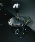 Next Level All Metal H Pattern And Sequential Sim Racing Shifter With Real Hall Effect Sensors For Plug And Play Setup And Ridiculously Smooth Shifts On Ps5 Xbox Pc, close-up of gear lever on desk.