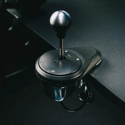 Next Level All Metal H Pattern And Sequential Sim Racing Shifter With Real Hall Effect Sensors For Plug And Play Setup And Ridiculously Smooth Shifts On Ps5 Xbox Pc, close-up of gear lever on desk.