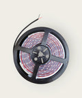8 Foot IP68 White Marine LED Strip Lights Submersible For Boats And Yachts, coiled on a black reel.