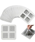 Fifty Pack Disposable Shower Drain Hair Catcher Stickers with tough adhesive mesh filter catching hair over a drain.