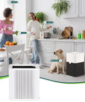 Kitchen scene with couple and dog using Replacement Filter For Blue Pure 211+ Air Purifier Non Auto for fresh air.