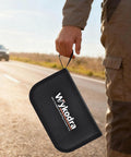 Person holding a case for Heavy Duty Tire Repair Kit With Screw Plugs And T Handle on roadside.