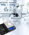 Dialed In Ultra Precise 500g Digital Gram Scale With 0.01g Resolution And Built In Level Bubble For Kitchen Jewelry Lab Coffee And Food Prep Black Professional Grade Since 2001 on a lab table with microscope.