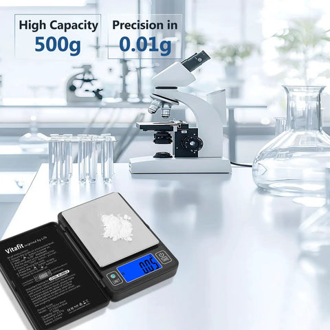 Dialed In Ultra Precise 500g Digital Gram Scale With 0.01g Resolution And Built In Level Bubble For Kitchen Jewelry Lab Coffee And Food Prep Black Professional Grade Since 2001 on a lab table with microscope.