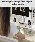 Person using White USB Powered Computer Speakers With Built In Audio Output For Crisp Digital Sound on a desk