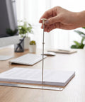 Sturdy Metal Binding Pin For Office And School Use Precise File Aligning Locating Pin in action on a desk with papers