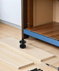 Four Pack Adjustable Furniture Leveling Legs With Heavy Duty Threaded Feet on floor near cabinet installation setup