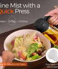 User pressing Smooth Operator Sixteen Oz Glass Olive Oil Spray Bottle With Dual Pour And Sprayer Function for salad misting.