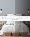 Bedroom scene with Oil Rubbed Bronze Wall Sconce With Frosted Glass Shade Dimmable Twist On Off Switch mounted above headboard.