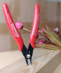 Five Inch Micro Flush Cutters Set Of Ten With Spring Loaded Action, red diagonal cutters on wooden surface for tight space precision