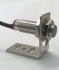 Close-up of a Hall proximity sensor mounted on an L bracket, part of the Go To RPM Tachometer Display Kit For Lathe And Conveyor Systems.