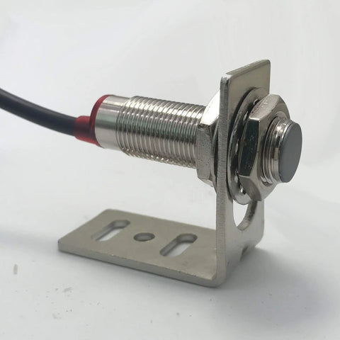 Close-up of a Hall proximity sensor mounted on an L bracket, part of the Go To RPM Tachometer Display Kit For Lathe And Conveyor Systems.