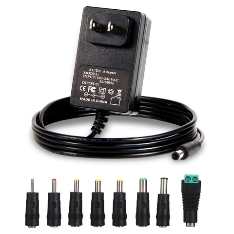 Universal 15V 1.5A Power Adapter With Interchangeable DC Plugs No Fuss 100-240V Input 50 60Hz 5.5x2.5mm Output Jack Center Positive Long 5.9 Ft Cable Great For Jump Starters Routers Laptops And More shown with cable and plug tips.