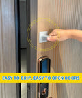 Hand using Two Pack Stick On Door Handles 6 Inch Self Adhesive Cabinet Handles Gray With Easy Peel And Stick Installation No Drill No Damage To Doors Ideal For Cabinets Sliding Screens Closets Showers Glass Windows Outdoor And Garage Pulls.