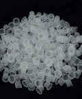 Large Tattoo Ink Cups 500 Pack Plastic Pigment Cups Size 15 Disposable Microblading Cups spread out for tattoo ink display