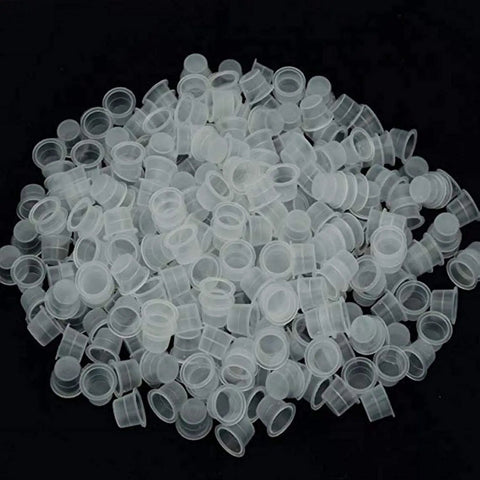 Large Tattoo Ink Cups 500 Pack Plastic Pigment Cups Size 15 Disposable Microblading Cups spread out for tattoo ink display