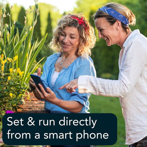 Two women using a smartphone to control Smart Hose Timer With Two Valves And One WiFi Hub App Controlled Outdoor Faucet Timer
