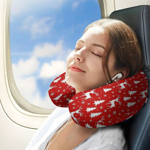 Person using U Shaped Neck Pillow For Travel And Office Use Napping, Reusable Lightweight Multi Functional Pillow For Airplanes, Trains And Cars, Polyester Soft Comfort, Red Reindeer Christmas Theme on airplane seat.
