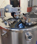 Close-up view of The Real Deal Commercial Stainless Steel Milk Pasteurizer Tank with motor and lid, built for heavy duty use.