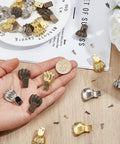 Hand holding decorative Dope Antique Zinc Alloy Feet Set 30 Pieces In 3 Colors for furniture, next to coin for size comparison.