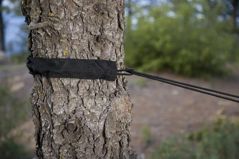 Tree Slings Camping Hammock Hanging Kit With Quick Setup Straps And Tree Friendly Trunk Sleeves on a tree