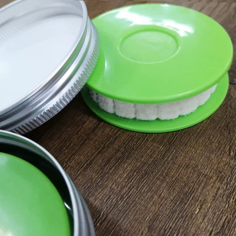 Two Pack Portable Bike Chain Oiler Roller Lubricator Round Lubricant Applicator With Aluminum Storage Jar Green on table