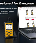 OBDII Diagnostic Tool next to laptop displaying product page, shows design for 1996+ cars with wireless printing and live data graphs.
