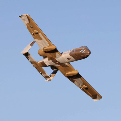 UMX A 10 Thunderbolt II RC Airplane With 30mm EDF BNF Basic AS3X Safe Select 562mm Wingspan in flight, multicolor fuselage visible