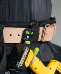 180 Degree Rotating Cordless Drill Holster Hook with foldaway design attached to a tool belt holding a drill