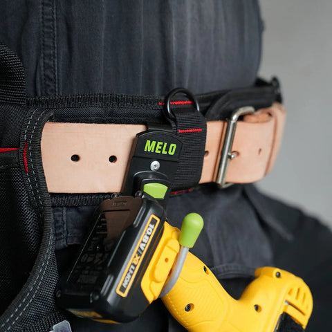 180 Degree Rotating Cordless Drill Holster Hook with foldaway design attached to a tool belt holding a drill