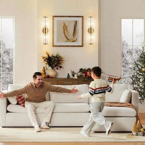 Living room with Sleek Dope Brushed Brass Vanity Light Fixture With Dual Glass Rods Wall Sconce on the wall, family bonding scene