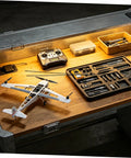 Workbench with model aircraft and toolkit, featuring Solid Carbon Fiber Rods For RC Planes 2mm Diameter By 500mm Length Pack Of 10