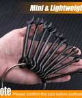 Backyard Mechanic Mini Wrench Set Packed With Metric And Sae Sizes 20 Piece showing mini steel spanners on a ring held in hand.
