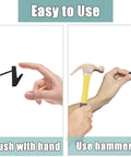 Demonstration of using Stainless Steel Picture Hanging Nails And Hooks 30 Pack Heavy Duty Push Pins Thumbtacks for walls with hand and hammer.