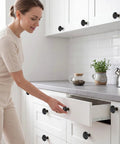 24 Piece Black Ceramic Cabinet Knobs Vintage Round Pulls revamp your space with a user installing a kitchen drawer.