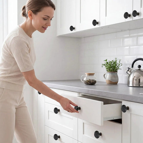24 Piece Black Ceramic Cabinet Knobs Vintage Round Pulls revamp your space with a user installing a kitchen drawer.